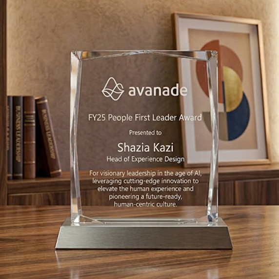 Avanade 2025 Global People Awards — People First Leader Award presented to Shazia Kazi, Head of Experience Design, with companion recognition pieces on marble in a city office.